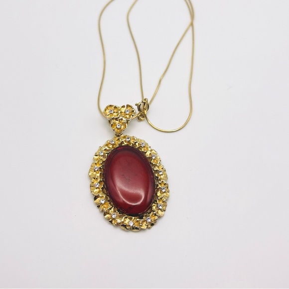 Jewelry - Genuine Baltic Red Amber pendant . Over gold